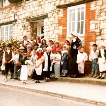 Children in 18C costume outside the Chapel Lane House which became the venue for Stock's School when the Church got too small