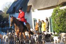 The hunt passing through the village